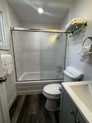 a bathroom with a shower and a toilet and a sink at #10 Lakeside Great Location Beach Access Dogs ok in Kings Beach