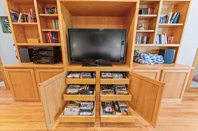 a entertainment center with a flat screen tv at Wooded Escape in Tahoe Vista Private Hot Tub in Tahoe Vista