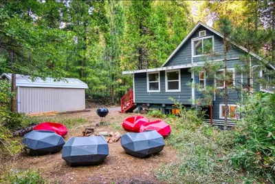a house with four picnic tables in front of it at Stay At 4K in Arnold