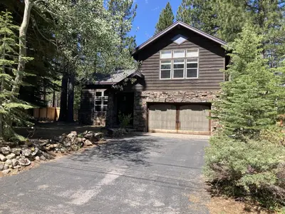 a house with a garage and a driveway at Serenity Summit in South Lake Tahoe