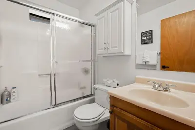 a bathroom with a shower and a toilet and a sink at Tahoe Peaks & Shores Getaway in Kings Beach