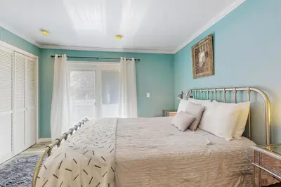 a bedroom with a large bed with blue walls at Mountain Serenity in Incline Village