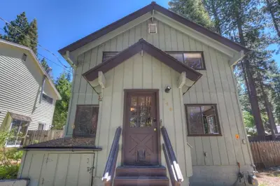 a small white house with a brown door at Peak Summer - Relax & Refresh - Charming Kings Beach in Tahoe Vista