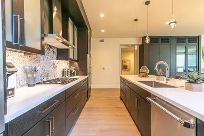 a kitchen with black cabinets and white counter tops at Crystal Bay Retreat 204 condo in Crystal Bay