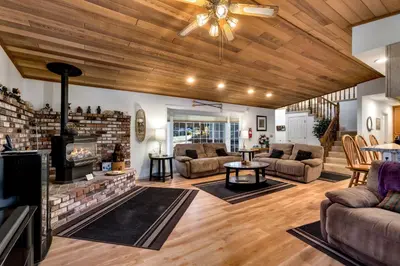 a living room with a fireplace and a couch at Panhandle House home in South Lake Tahoe