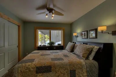a bedroom with a bed and a window at Rock Haven condo in Stateline
