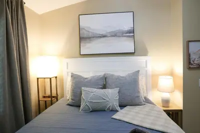 a bedroom with a bed with blue sheets and pillows at Sequoia Serenity 4 Mi to Sequoia, King Bed in Three Rivers