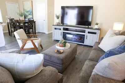 a living room with a couch and a tv at Sequoia Serenity 4 Mi to Sequoia, King Bed in Three Rivers