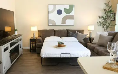 a living room with a couch and a table at Sequoia Serenity 4 Mi to Sequoia, King Bed in Three Rivers