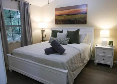 a bedroom with a white bed with two pillows on it at Sequoia Serenity 4 Mi to Sequoia, King Bed in Three Rivers