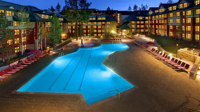 a large swimming pool in front of a building at Marriott Timber Lodge 1BR Apartment with Resort Access in South Lake Tahoe