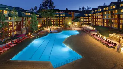 a large swimming pool in front of a building at Marriott Timber Lodge 2BR Apartment with Resort Access in South Lake Tahoe