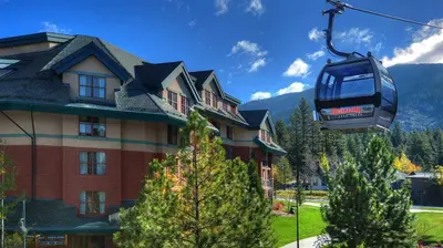 a gondola lift in front of a house at Marriott Timber Lodge 2BR Apartment with Resort Access in South Lake Tahoe