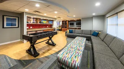 a living room with a couch and a ping pong table at Marriott Timber Lodge Studio Apartment with Resort Access in South Lake Tahoe
