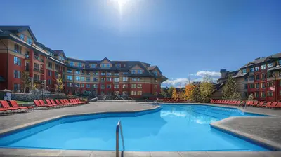 a large swimming pool in front of a building at Marriott Timber Lodge Studio Apartment with Resort Access in South Lake Tahoe