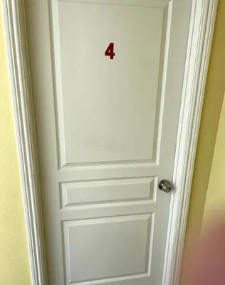 a door with the number four on it at la paz private room with jacuzi in Fresno