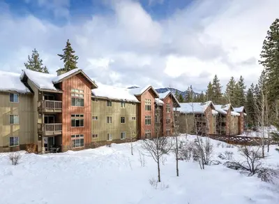 a group of apartment buildings in the snow at Wyndham South Shore 2BR Apartment with Resort Access in Zephyr Cove