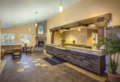 a lobby of a restaurant with a large stone counter at Wyndham South Shore 2BR Apartment with Resort Access in Zephyr Cove