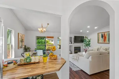 a living room with a white couch and a table at Elegant Retreat- Sleep 10-Boho Dome Lounge-Hot Tub-Games-Golf-Serene Getaway in Sacramento