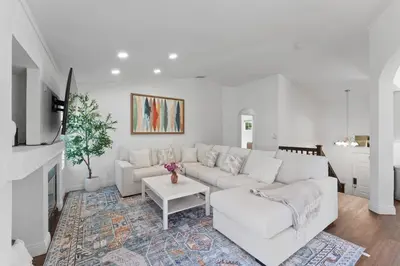 a white living room with a white couch and a table at Elegant Retreat- Sleep 10-Boho Dome Lounge-Hot Tub-Games-Golf-Serene Getaway in Sacramento