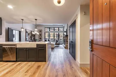 a kitchen with a large island in a room at Catamount Lodge 101 by East West Hospitality in Truckee