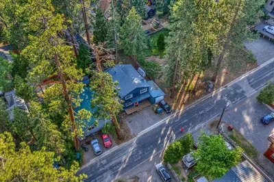 an overhead view of a blue house with a parking lot at Tahoe City Gem Pet Friendly Yard Walk to Beach in Tahoe City