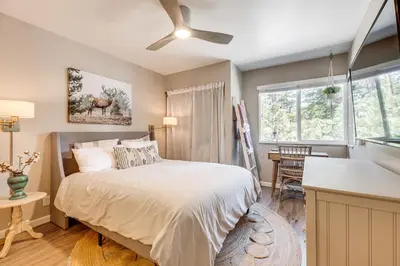 a bedroom with a bed and a window at Stroll to The Village Year-Round Family Getaway in Mammoth Lakes