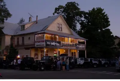 a group of people standing in front of a building at Georgetown Hotel and Saloon in Georgetown