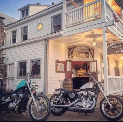 two motorcycles parked in front of a house at Georgetown Hotel and Saloon in Georgetown
