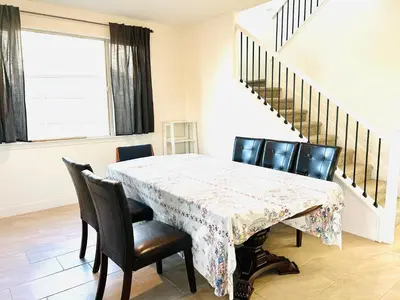 a dining room with a table and chairs at Cozy Private master bedroom in a single family house in Elk Grove