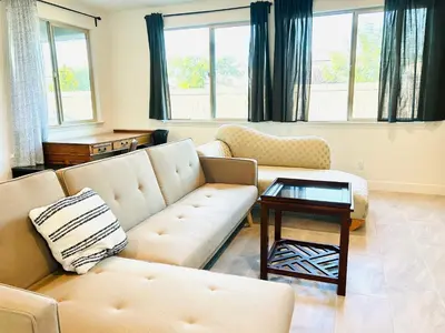 a living room with two couches and a table at Cozy Private master bedroom in a single family house in Elk Grove