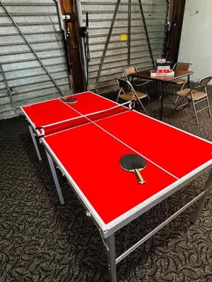 a red ping pong table with a ping pong ball on it at Family Fun-Dogs ok-Bass lake-Yosemite-Sleeps 8 in Oakhurst