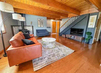 a living room with a couch and a table at On Golf Course, Family&Pet Friendly Yosemite Basecamp in Groveland