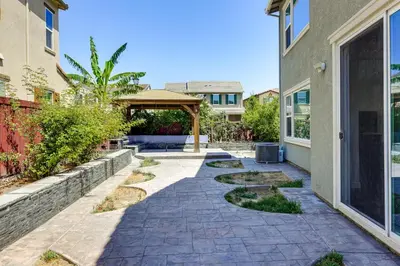 a walkway in a yard with a gazebo at Walk to Parks Mountain House Retreat with Patio! in Tracy