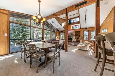 a dining room with a table and chairs at Front and Center at Palisades by Tahoe Getaways - 3BR, Walk to Palisades! in Olympic Valley