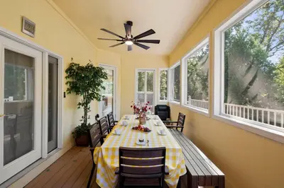 a dining room with a table and a ceiling fan at Stylish 6 Bdr home, GameRoom, near Lake | Yosemite in Groveland