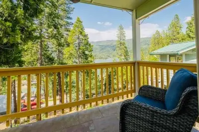 a porch with a chair and a view of the mountains at Lakeview Haven - Boat Slip - Dog Friendly - Sleeps 16