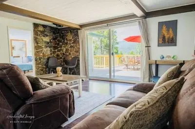 a living room with a couch and a table at Lakeview Haven - Boat Slip - Dog Friendly - Sleeps 16