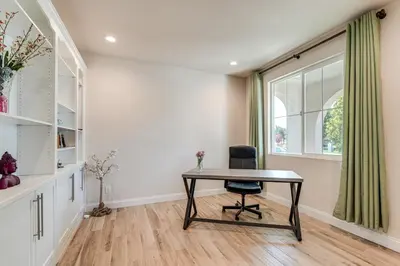 a desk with a chair in a room with a window at Patio and Outdoor Kitchen Manteca Family Home in Manteca