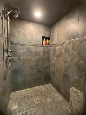 a bathroom with a shower with a television in it at Ranch Resort Suite Near Sequoias in Woodlake