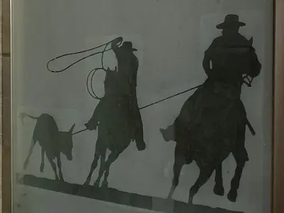 a drawing of two men riding horses with a lasso at Ranch Resort Suite Near Sequoias in Woodlake