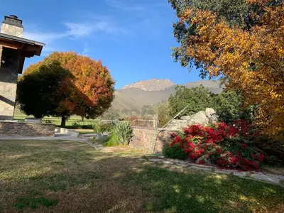 a view of a garden with mountains in the background at Ranch Resort Suite Near Sequoias in Woodlake
