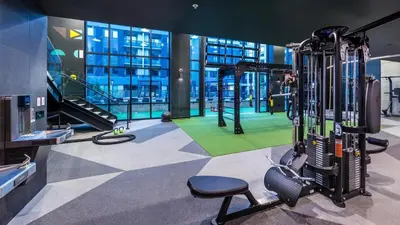 a gym with tread machines in a building at Landing at RED in Reno