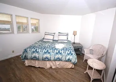 a bedroom with a bed and a table and chairs at 2078 Traverse Court home in South Lake Tahoe