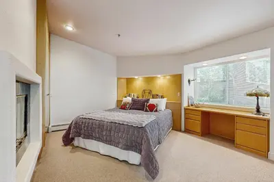 a bedroom with a bed and a desk and a window at Incline Village Retreat in Incline Village