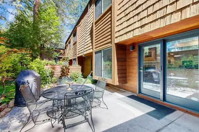 a patio with a table and chairs in front of a house at Incline Village Retreat in Incline Village
