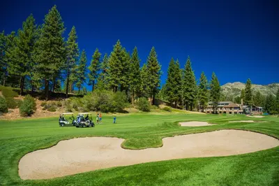 a golf course with a golf cart on a green at Incline Village Retreat in Incline Village