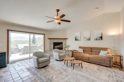 a living room with a couch and chairs and a fireplace at Mtn Views and Game Room Family Retreat in Groveland in Groveland