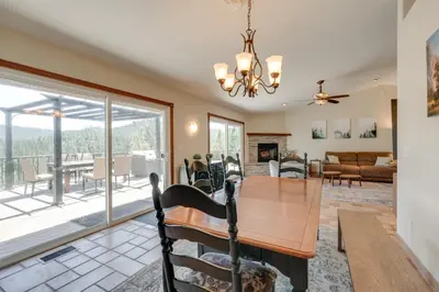 a dining room and living room with a table and chairs at Mtn Views and Game Room Family Retreat in Groveland in Groveland