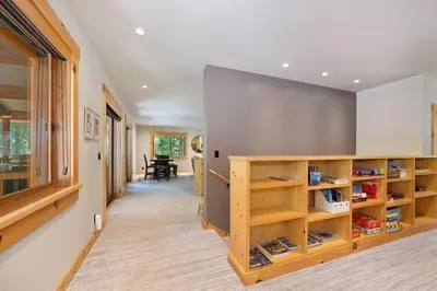 a hallway of a house with wooden shelves at Big Chief River Retreat-Located on Truckee River in Truckee